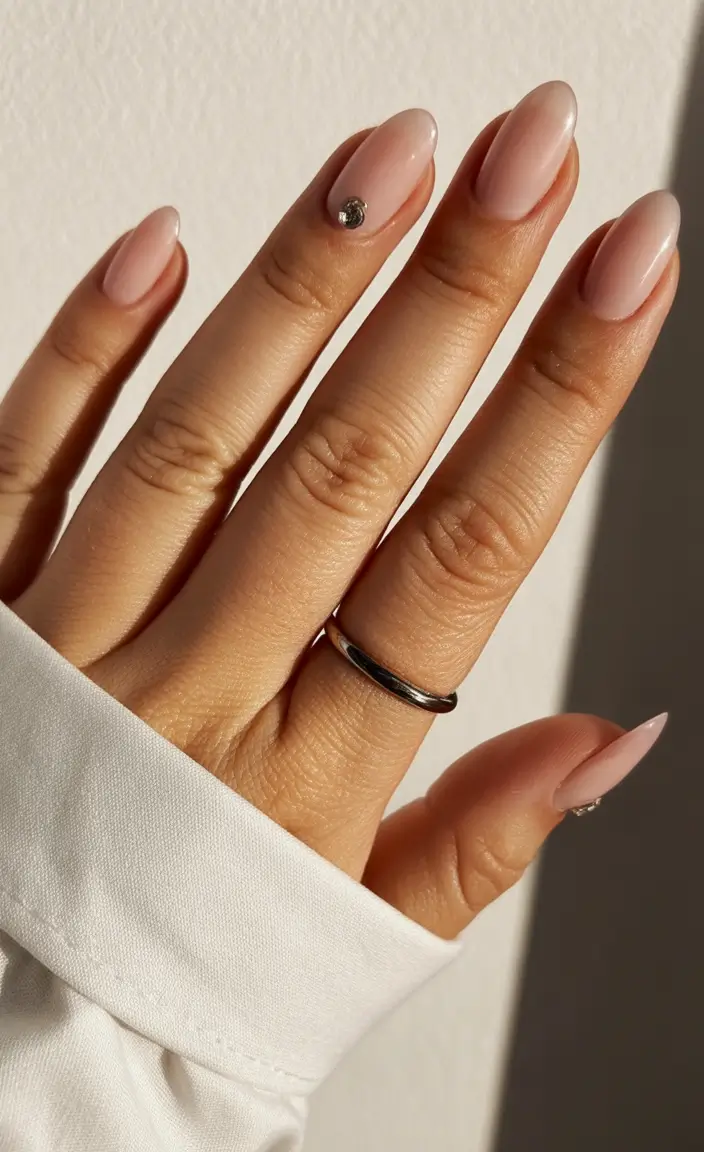 neutral fall nails Delicate Nude with a Gem