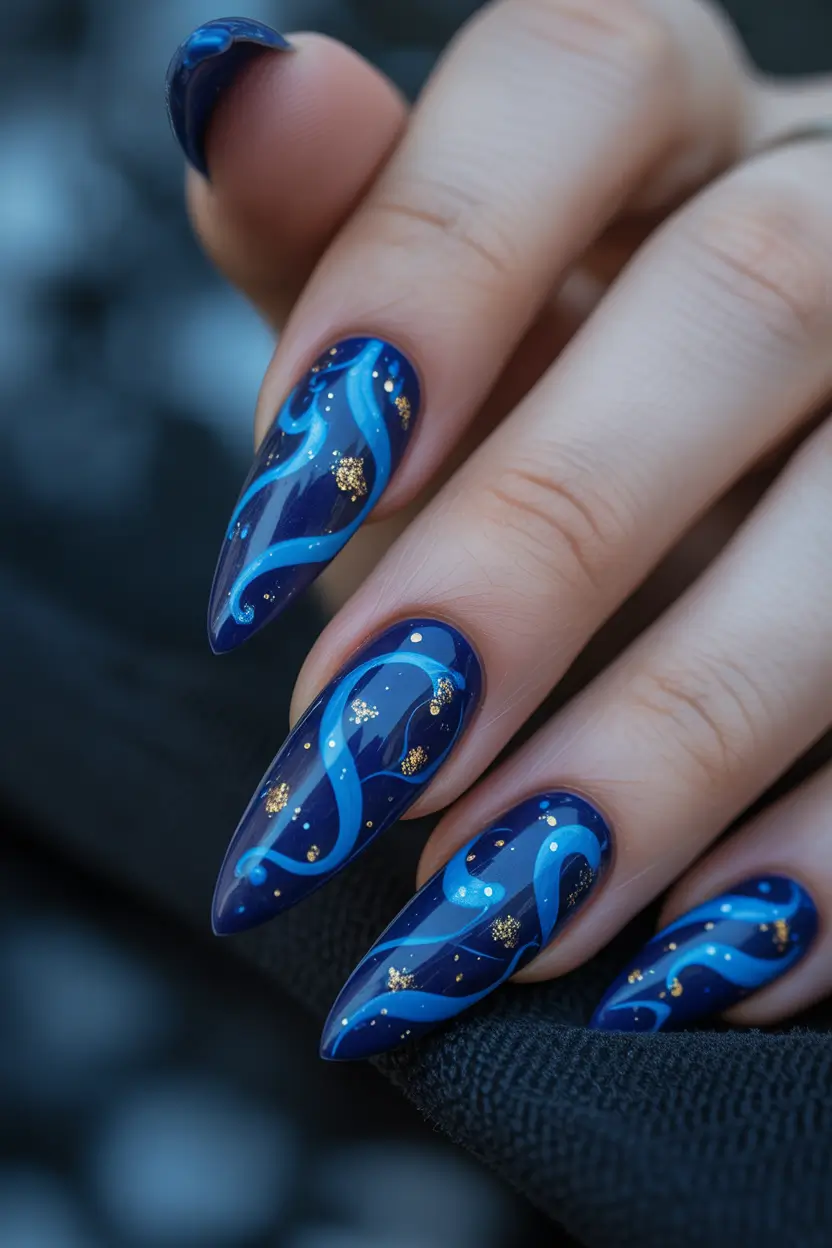 blue winter nails midnight waves and golden sparkles