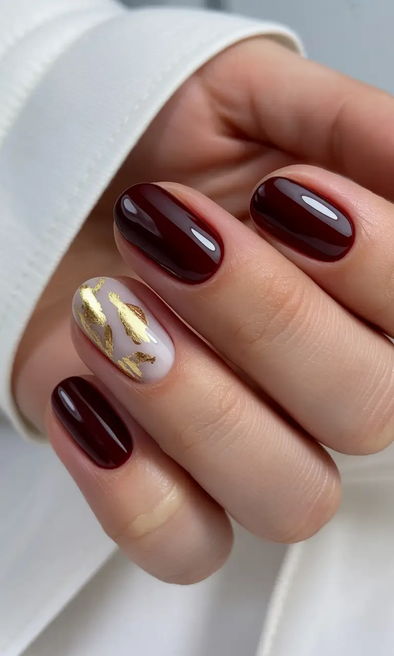 easy winter nails design and color ideas Garnet Elegance with Gold Leaf Accents