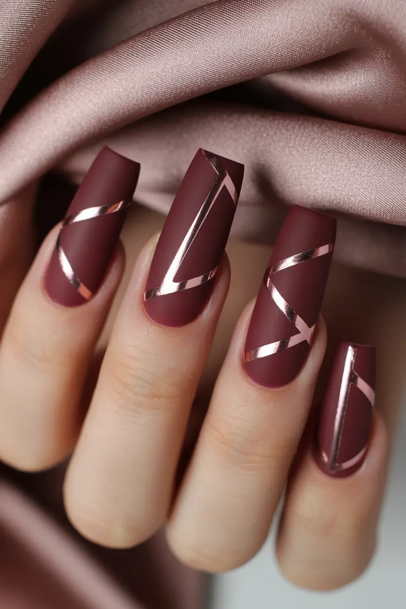 winter nails - new color trends Velvet Burgundy with Metallic Stripes