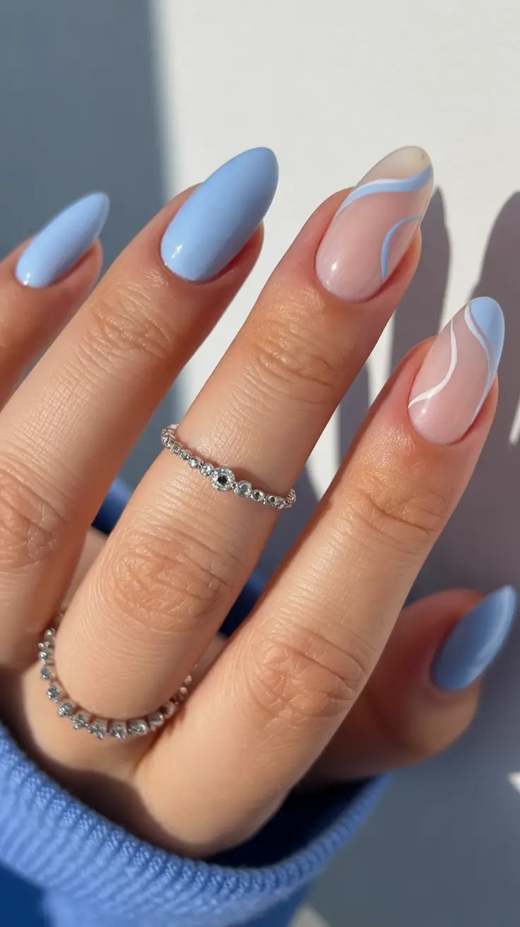 light blue nails Soft Almond Blues With Flowing White Lines