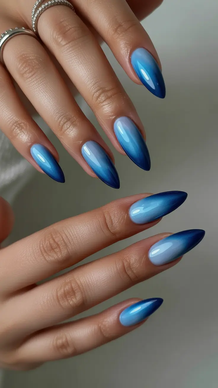 simple nails Blue Gradient Almond Nails With a Modern Cool Tone