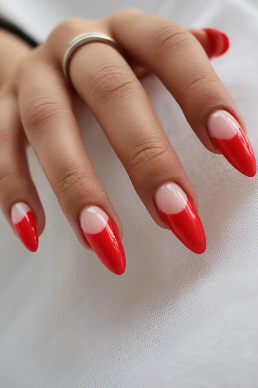 red nails Glossy Red French Almond Nails With a Clean Modern Edge