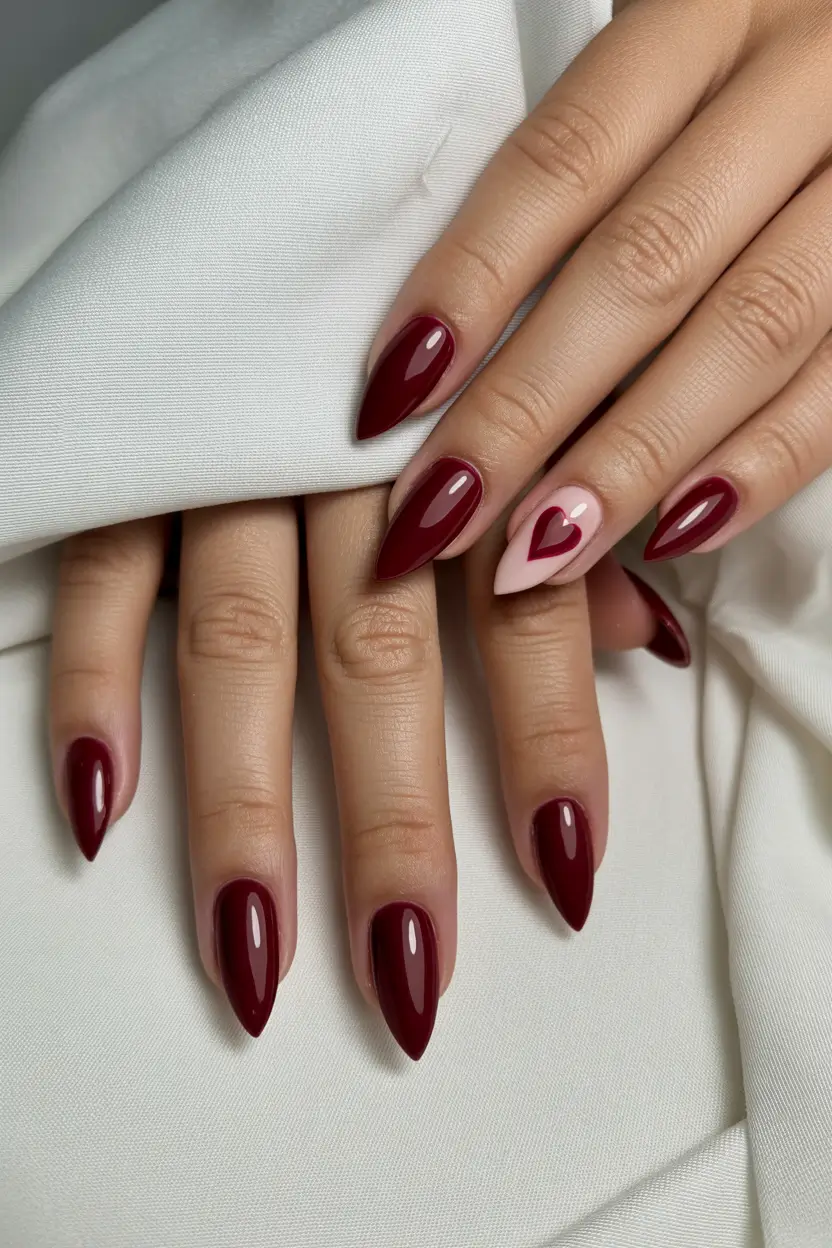 red nails Deep Red Nails With a Minimal Heart Accent