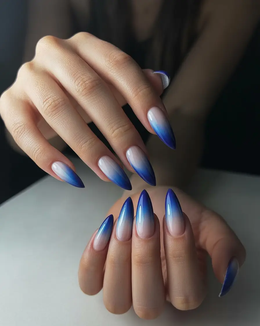 February nails Blue Gradient Almond Nails With a Soft Winter Edge