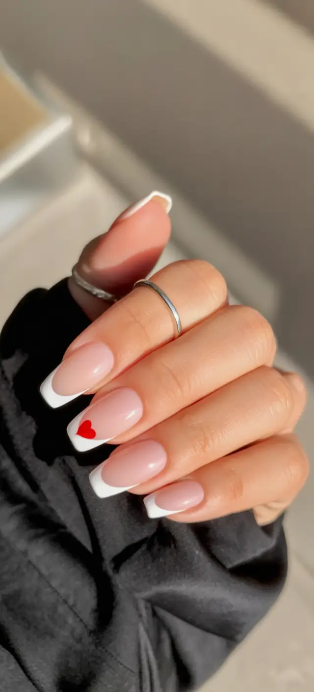 February nails Soft French Almond Nails With a Tiny Red Accent