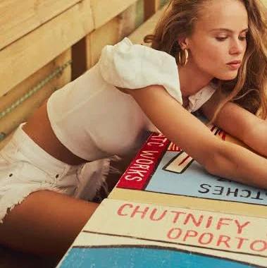 top H&M Ladies Off-The-Shoulder Puff-Sleeved Top H&M $14.99