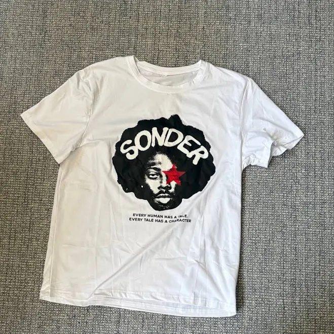 top White Graphic T-Shirt with Black and Red Design | Color: Black/White | Size: L | Lisaheskett's Closet Poshmark $8