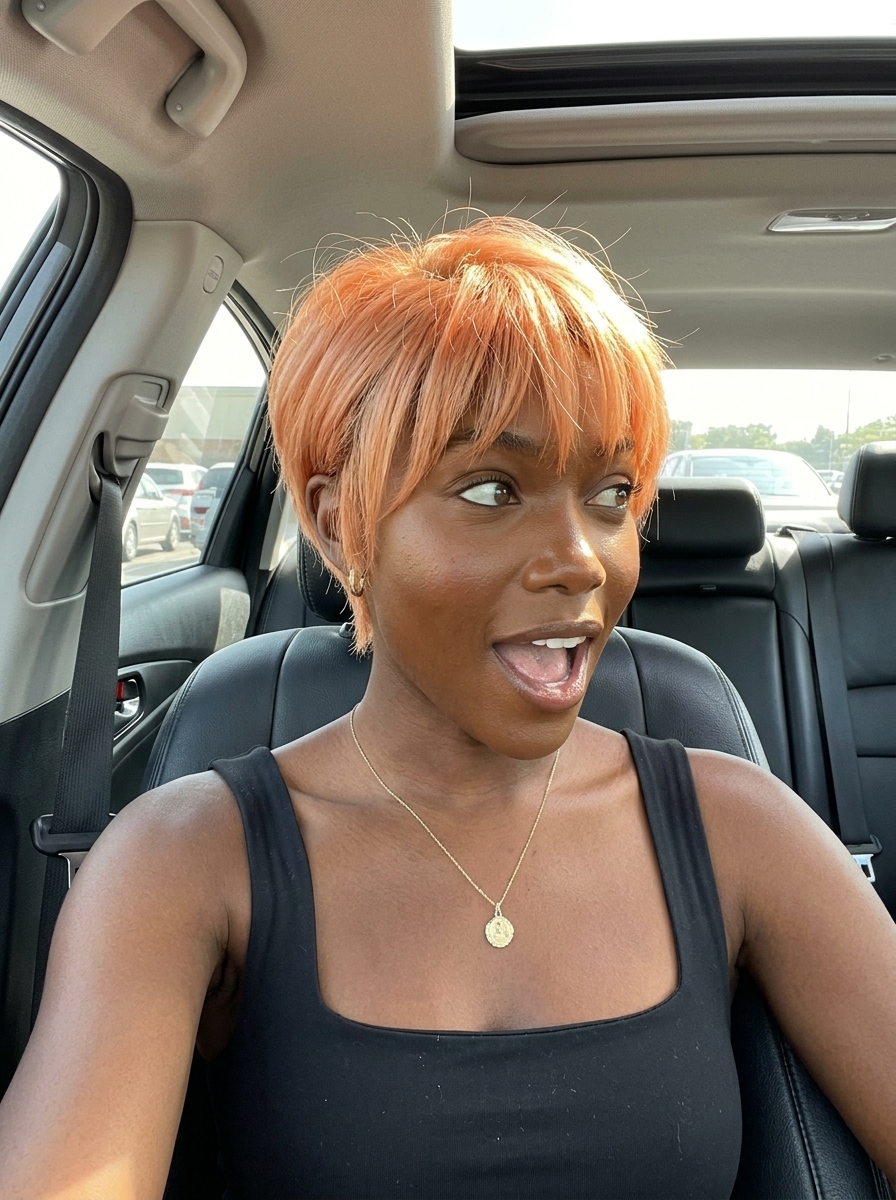 short apricot crush pixie with peach undertones, textured crown, piecey curtain bangs — energetic
