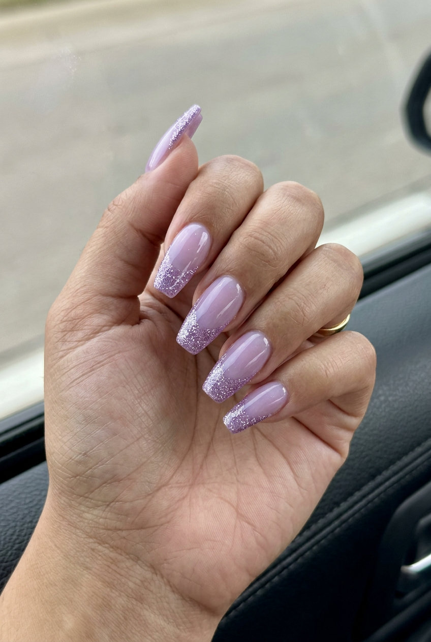 June Nails Ideas: Glitter French Tip 2026 Glamorous sparkling lavender glitter French tip nails for summer 2026 parties.