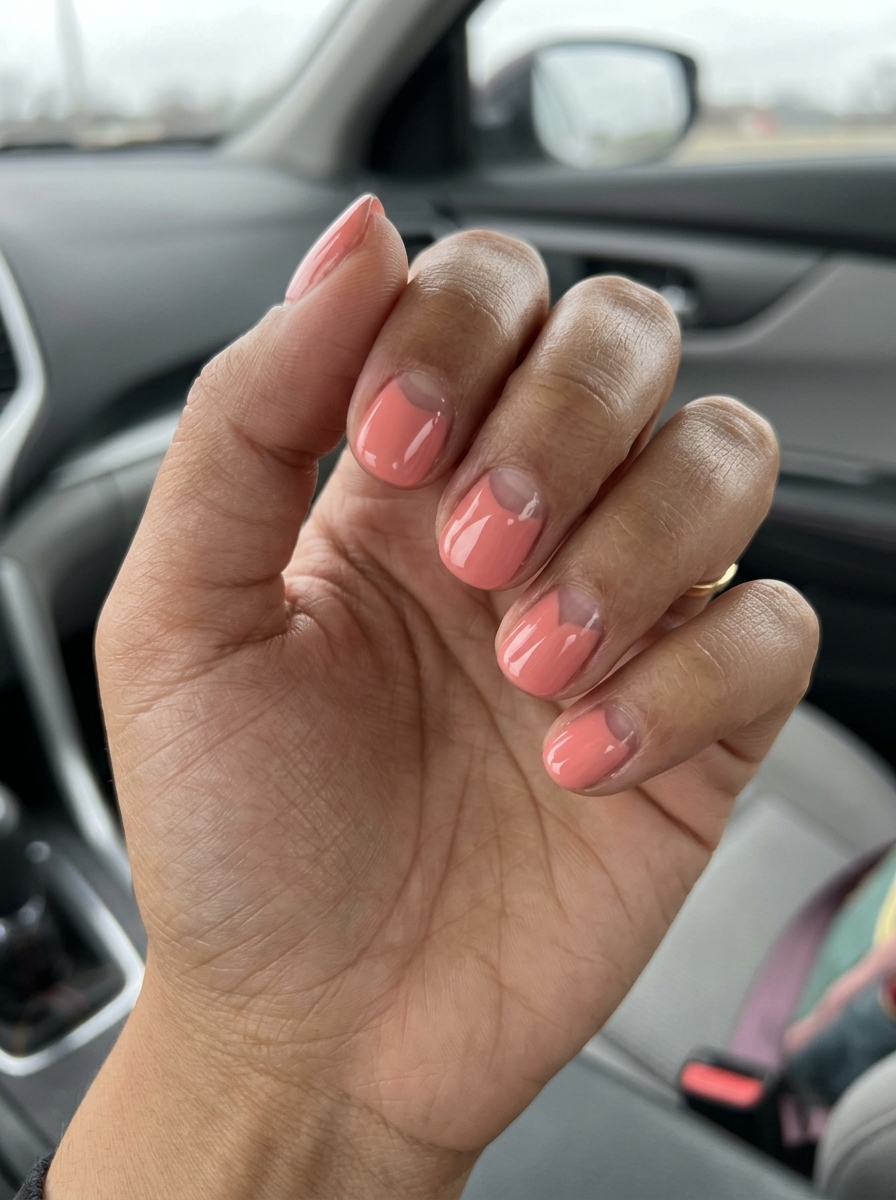 Simple short summer nails 2026: Coral Negative Space, edgy design with soft coral and clear base.