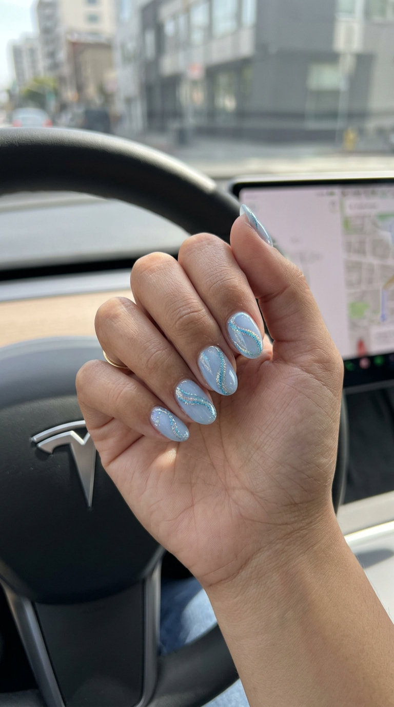 Holographic blue swirls on sheer base for summer glitter nails 2026. Futuristic, clean daily wear.
