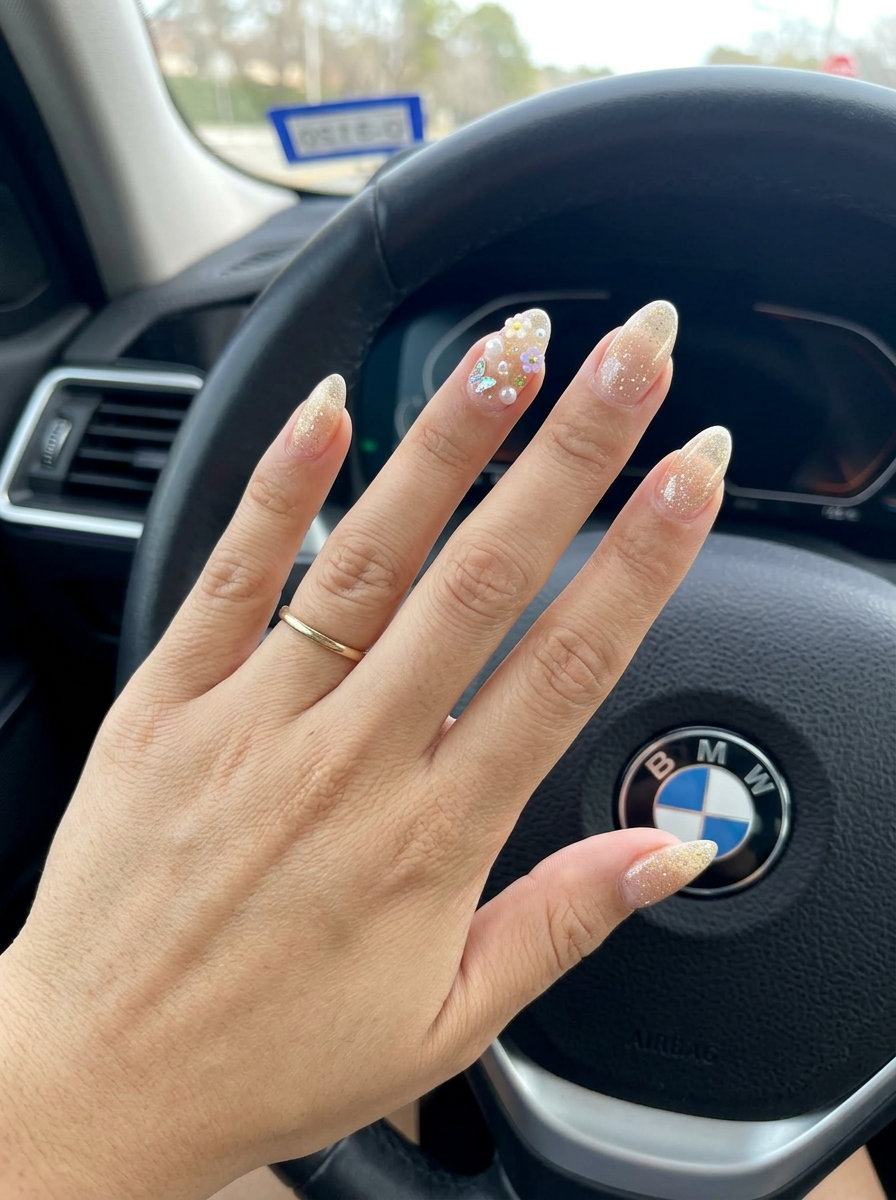 Nude Base with Whimsical Charm Garden nails for summer glitter nails 2026. Playful vacation style with iridescent charms.
