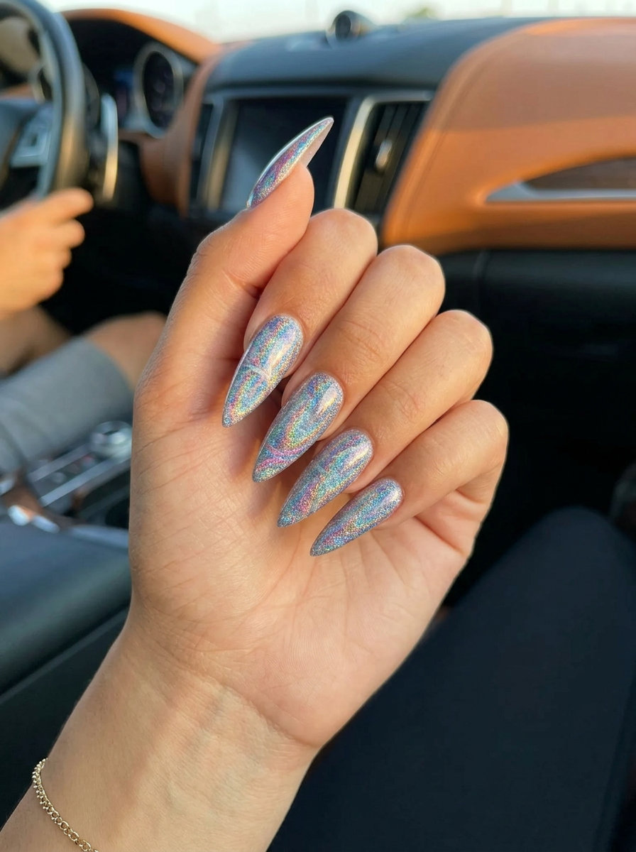 Cosmic glitter swirl stiletto nails for summer holiday nails 2026. Glamorous and bold for festivals.