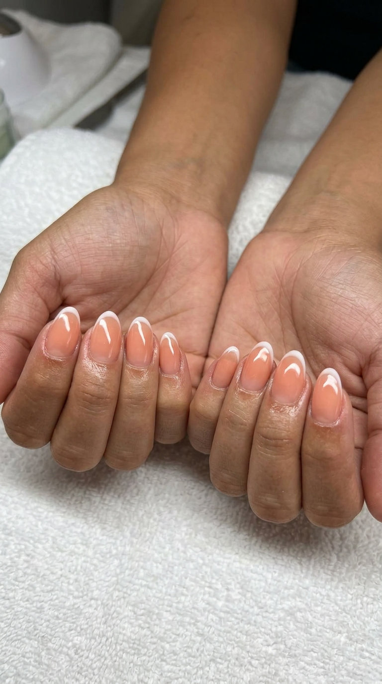 Sheer peach jelly nails with micro French tip for summer holiday nails 2026. Perfect for daily wear, work, or vacation.