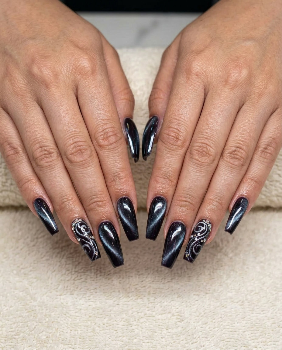 Futuristic chrome cat-eye swirls for parties, a bold summer nail art idea 2026.