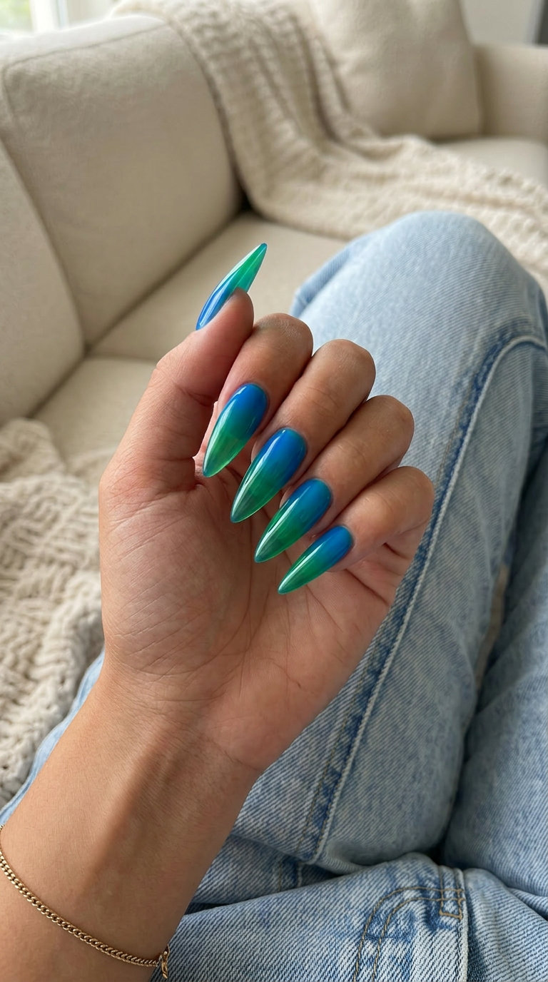 Vibrant Tropical Ombre Stiletto Nails 2026 Edgy tropical blue to green jelly ombre stiletto nails for vacation or festivals. Summer ombre nails 2026.